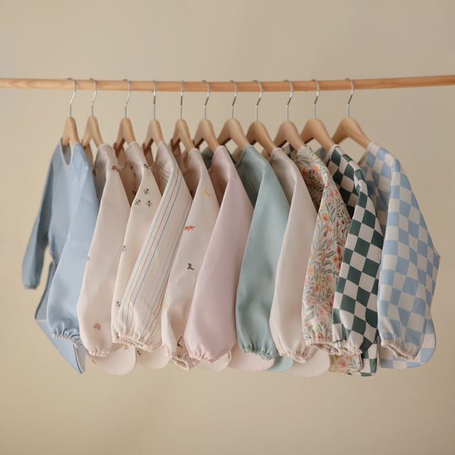 Mushie bib ar piedurknēm Blush