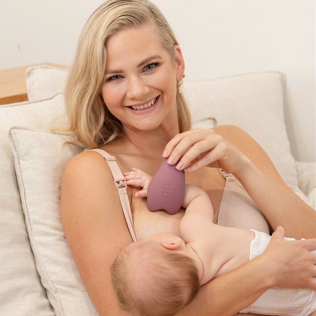 Momcozy krūtinės masažuoklis su šildymo ir vibravimo funkcija