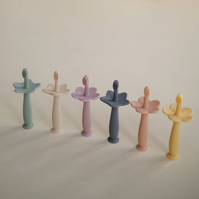 Mushie mokomasis silikoninis dantų šepetėlis (Tradewinds)