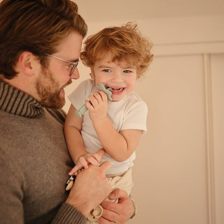 Mushie izglītojoša silikona zobu birste (Cambridge Blue)