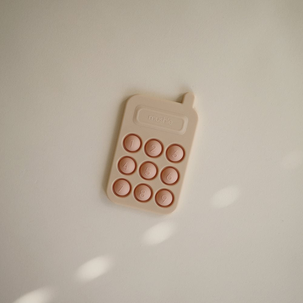 Mushie pop it žaislas Telefonas Blush