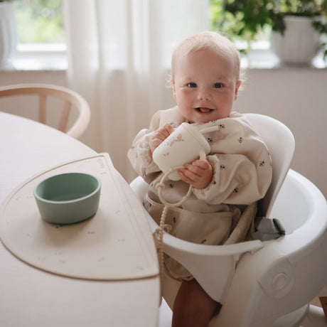 Mushie bib ar piedurknēm Blush