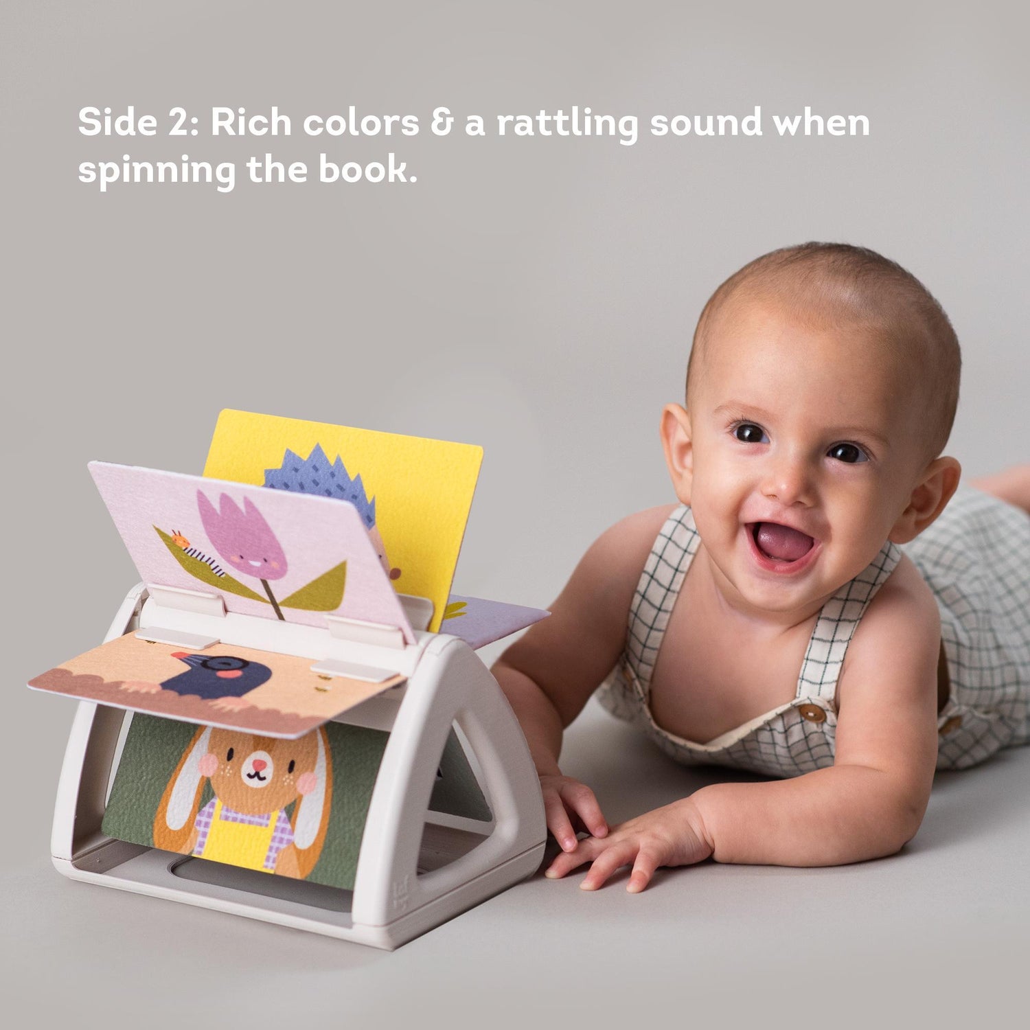 Taf toys lavinamoji besisukanti knygelė Tummy Time Spinning Book