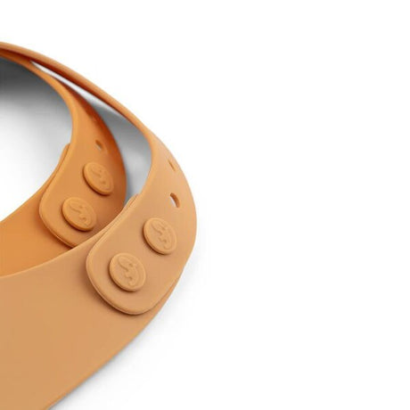 Done by Deer silikoninių  seilinukų rinkinys Raffi Mustard (2 vnt.)