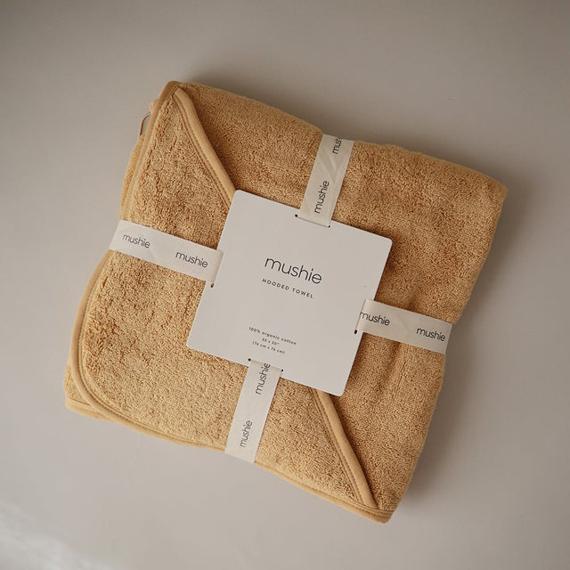 Mushie rankšluostis su gobtuvu Fall Yellow